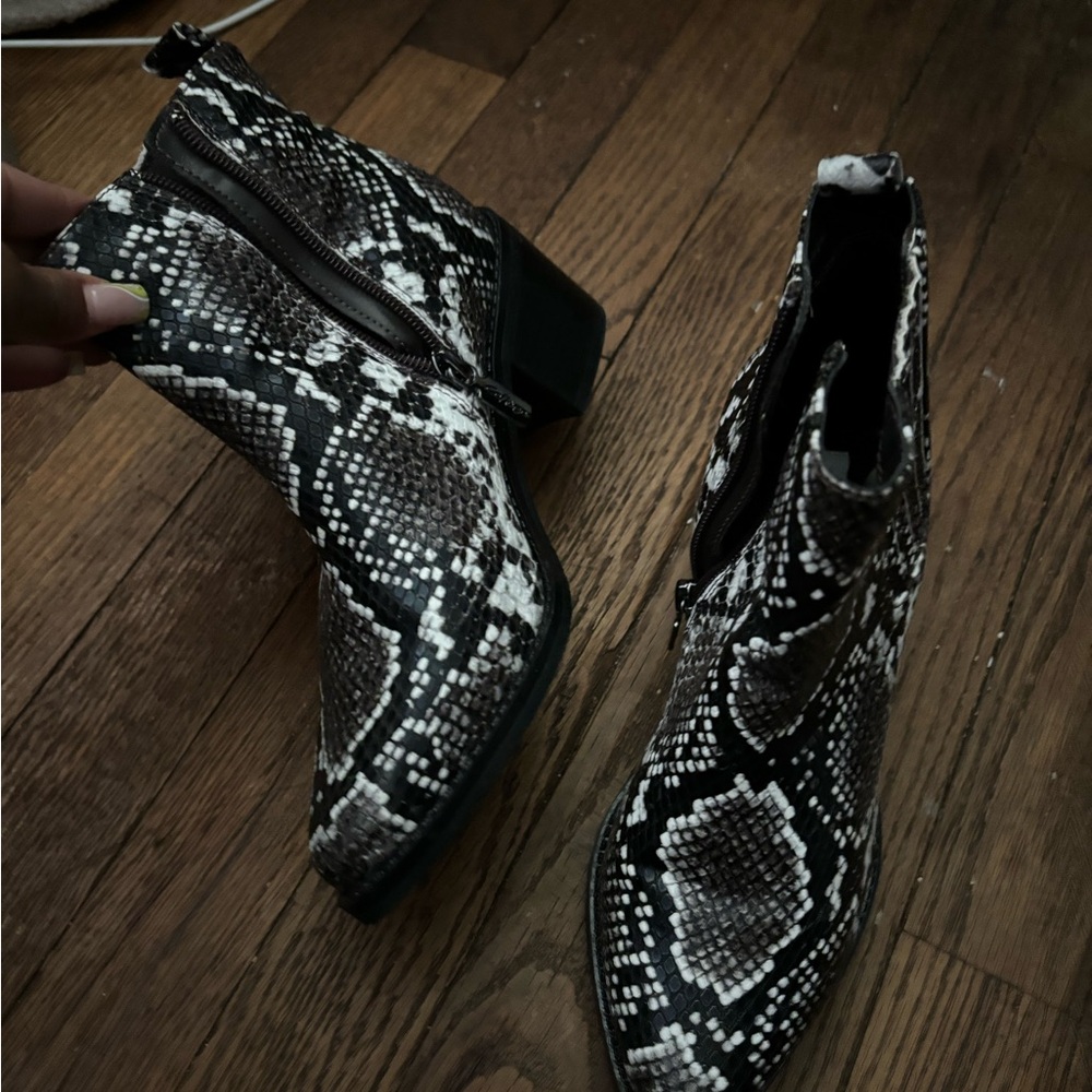 Brand new black snakeskin booties size 6 1/2 in a woman